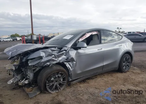 2025 Tesla Model Y Long Range Dual Motor All-Wheel Drive z USA, uszkodzony, nr VIN 7SAYGDEE0SF297224